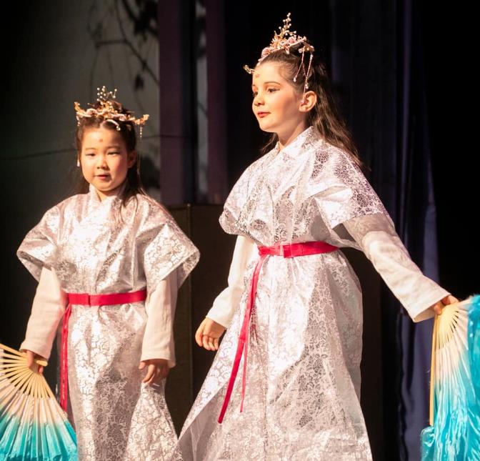 Boys and girls in ArtReach's Mulan play
